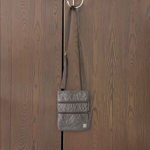 Ellington dark gray small purse with adjustable strap.